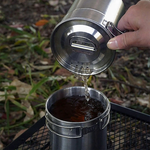 Pouring water into Two In One Camping Cup Set With 33oz Big Cup And 24oz Small Cup, 304 stainless steel, vented lid, outdoor cooking