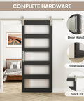 Built Like A Tank 36 By 84 Inch Glass Barn Door With Frosted Tempered Panes And Sturdy Wood Core In Deep Black Hue and hardware.