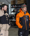 Two men wearing Carbon Snowmobile Suit Set With Hydraguard Pro Tech Ride Ready 10K Waterproof and 8K Breathable Shell Gear