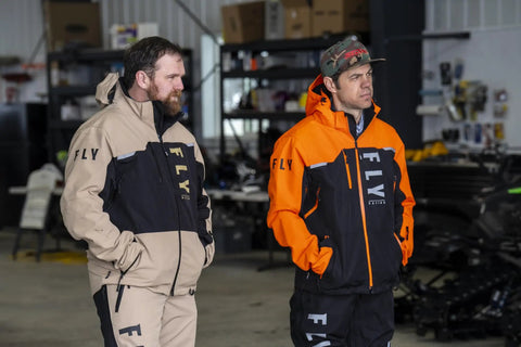Two men wearing Carbon Snowmobile Suit Set With Hydraguard Pro Tech Ride Ready 10K Waterproof and 8K Breathable Shell Gear