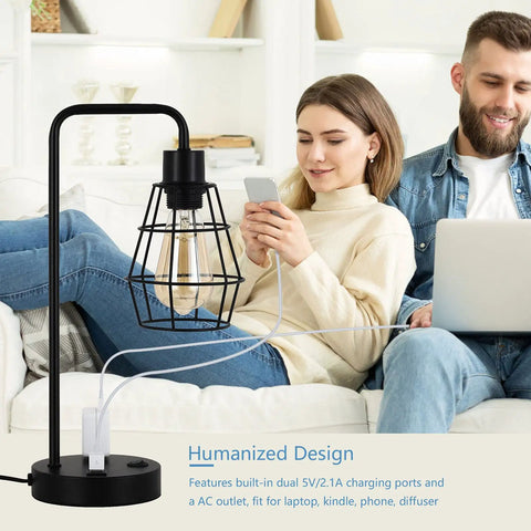Two Pack USB Edison Desk Lamps With Dual USB Ports And 2 Prong Outlet next to people on a couch, in a living room setting.