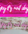 Pink Neon Nail Sign For Nail Salon And Beauty Studio Decor LED Light Open Sign Wall Art Perfect For Nail Rooms, Beauty Bars, Spas, Shops, And Home Makeovers showing 'Yay it's nail day' illuminated and off.