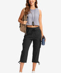 Woman wearing black XL Women's Six Pocket Cargo Capris For Travel And Hiking, Lightweight Quick Dry Pants With Moisture Wicking Fabric And UPF 50+