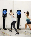 Two fencers using Pro Grade Double Sided Rubber Fencing Target for Training Hanging Wall Mounted Practice Tool.