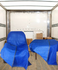 Four Pack Heavy Duty Moving Blankets For Furniture Protection Quilted Padding 72 By 80 Inches Blue covering furniture in a truck