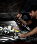 Man using Ultra Bright Tactical Flashlight With 900 Lumen Zoomable Beam And Adjustable Focus, 3 Light Modes to work on car engine