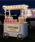 Slick Custom Mobile Food Cart With Roof And Heavy Duty Portable Vendor Display Kiosk For Coffee Snacks Desserts Trade Shows Plus Full Color Branding Makeover with popcorn and glowing lights.