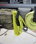 Side view of SINOKING rubber clamp on a vehicle tailgate with neon-yellow straps