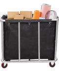 Built Like A Tank 12 Bushel Laundry Cart loaded with boxes and materials, heavy duty stainless steel, smooth rolling organizer.