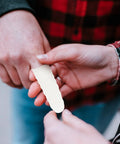 100 Piece Anti Static Nitrile Finger Sleeves For Electronic Repair And Cleanroom Work being applied to a hand for protection.
