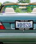 Convertible car with Custom License Plate Frame With Your Own Text Personalize Now, showing rear view with frame on plate
