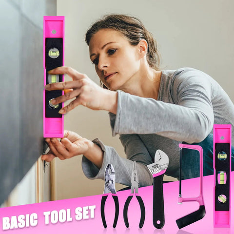 Woman using pink level from Pink 205-Piece Tool Kit For Gals With USB Electric Screwdriver And Drill Adapter in DIY home project