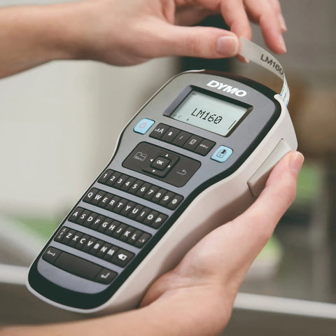 Badass Portable Label Maker Featuring Authentic Qwerty Keyboard And Rapid Response Touch Keys with printed label in hand.
