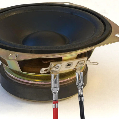 Red and black wires with spade terminals attached to speaker, part of 30 Piece Spade Crimp Terminal Kit With Insulating Sleeves And 20cm Wires