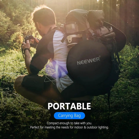 Man holding 43 Inch 110cm 5 In 1 Collapsible Light Reflector Diffuser With Bag For Studio And Outdoor Photography, in forest scene.