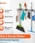 Heavy Duty Wall Mount Broom And Mop Holder With 3 Tier Racks And 4 Hooks 17 Inch Stainless Steel Organizer For Garage Kitchen And Laundry Ultimate Clutter Busting Tool Hanger To Maximize Wall Space, shown mounted with cleaning tools.