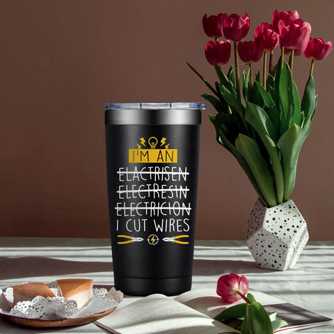 20oz Electrician Tumbler Gift For Men Hilarious On Site Gear No Brainer Gift For Dad Husband Boyfriend Or Co Worker Electrical Engineer Gift Christmas Birthday Fathers Day with humorous print next to flowers and pastries.