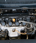 Car engine featuring magnetic components and flexible drill bit extension set for home DIY and repairs in tight spaces.