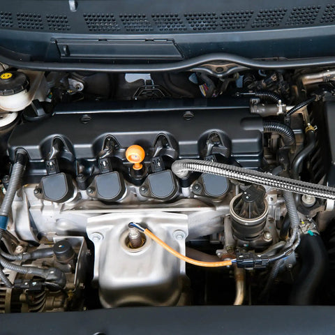 Car engine featuring magnetic components and flexible drill bit extension set for home DIY and repairs in tight spaces.