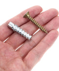 Hand holding parts of 40 Piece Drywall Anchor Kit With Screws, Rust Proof Steel Expansion Anchors For Wood And Hollow Walls, Heavy Duty