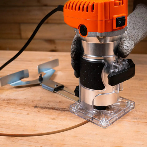 Powerful 6.5 Amp Variable Speed Wood Router Workhorse 1.25 HP Trim Router with six speed settings on workbench.