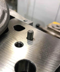 Heavy Duty 50 Pack M2 Dowel Pins 2 Millimeter X 50 Millimeter Long 304 Stainless Steel cylindrical dowel pin in a metal hole.