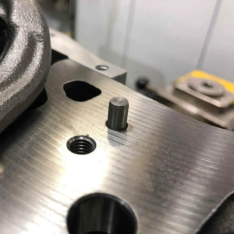 Heavy Duty 50 Pack M2 Dowel Pins 2 Millimeter X 50 Millimeter Long 304 Stainless Steel cylindrical dowel pin in a metal hole.