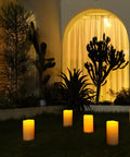 Large 4x10 Waterproof Outdoor Flameless Candles Battery Operated LED Pillar Lights With Remote And Timers in garden