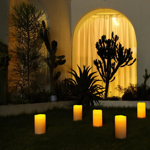 Large 4x10 Waterproof Outdoor Flameless Candles Battery Operated LED Pillar Lights With Remote And Timers in garden