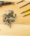 Heavy Duty Golden U Nut Fasteners For Truck And Rig 50 Pack on wood surface, showing nut clips for secure mounting.