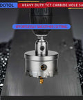 Front view of HIDOTOL 20pc TCT carbide hole saw kit; metal hole saw mounted on a drill cutting a metal sheet.