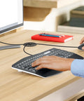 Kick Your Cable Chaos To The Curb With These Petal Shaped Nylon Grommets And Wire Hole Covers For Neat Cord Management On Metal Wooden Or Acrylic Panels Set Of Five 25Mm Buckles For A Slick Tight Workspace Build. Desk setup showing keyboard, mouse, and grommet.