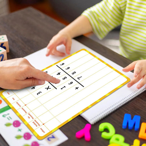 Hands using 12 Pack Double Sided Whiteboards 9x12 Inches for Math Practice with child, focus on long division and computation.