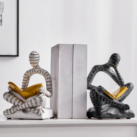 Heavy Duty Decorative Book Ends For Shelves With Thinker Statue Design on white shelf, resin material, supporting upright books.