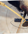 Golden Portable Tie Tool With Hook For Quick Fence Tying On Job Sites Pro Grade Wire Twisting Tool With Textured Grip shown in use