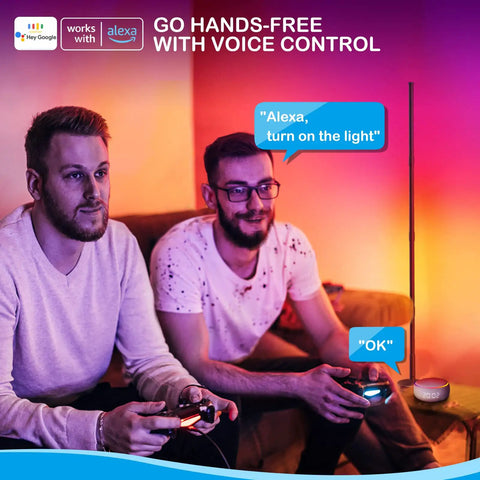Two people using Smart RGB Corner Floor Lamp With WiFi App Control Alexa And Google Assistant in living room with gaming setup.