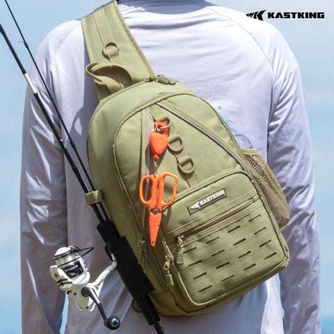 Karryall Sling Tackle Bag For Fishing with rod holder, MOLLE system, shown on person wearing white shirt, outdoors.