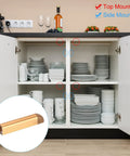 Open kitchen cupboard with Push To Open Door Latch Set Aluminum Alloy Magnetic Latches, gold finish, showing top and side mounting