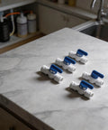 5 Piece 3/8 Inch Quick Connect Shut Off Ball Valve Push Fit Polypropylene Connector For Water Filter Lines on a countertop.