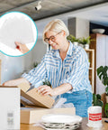 Woman using Move Day Must Have Dish Packing Kit That Hits Hard On Protection With 320 Foam Pouches And Sheets In Four Sizes