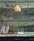 Coastal Rope Rattan Handwoven Pendant Lamp In Natural Finish hanging over a rustic table with decor items.