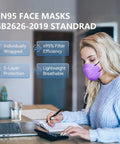 Woman wearing purple KN95 Face Masks Small Size 40 Pack with Five Layers of Protection, writing at desk, breathable and comfy fit