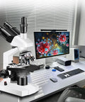 Trinocular Microscope For Adults 40X-5000X Magnification, Lab Grade With Dual Mechanical Stage And HD USB Camera, Electronic Eyepiece, Wide Angle Eyepieces, Ideal For Education, Research, And Digital Imaging on desk with monitor