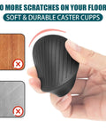 Hand holding a black caster cup from the Two By Two Rubber Caster Cups Set Of Four Non Slip Round Furniture Pads With Anti Slip Gripper Floor Grip For Beds Couches And Tables Stay Put On Any Floor Surface Leg Coasters And Floor Protectors.