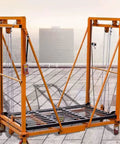 Heavy Duty Electric Forklift Lift showing smooth operator remote scaffold with locking casters on a rooftop.