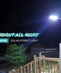 Ultra Bright 500W Solar Street Light Outdoor With 35000 Lumens LED illuminating a yard at night from a pole mount, IP65 waterproof