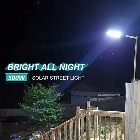 Ultra Bright 500W Solar Street Light Outdoor With 35000 Lumens LED illuminating a yard at night from a pole mount, IP65 waterproof