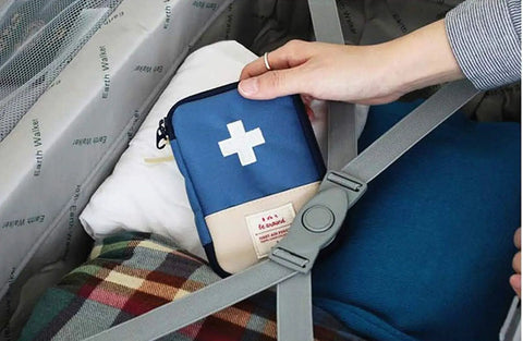 Two Pack Grab And Go First Aid Bag Portable Medical Kit for outdoor use in blue, displayed in travel luggage with straps.