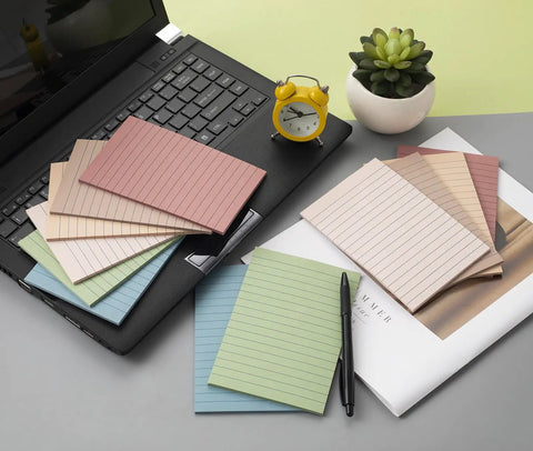 12 Pack Lined Sticky Notes 4x6 Inches With Ruled Sheets displayed on desk with laptop and clock