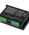DM556 stepper motor driver module; black metal enclosure with green screw-terminal blocks and cooling fins